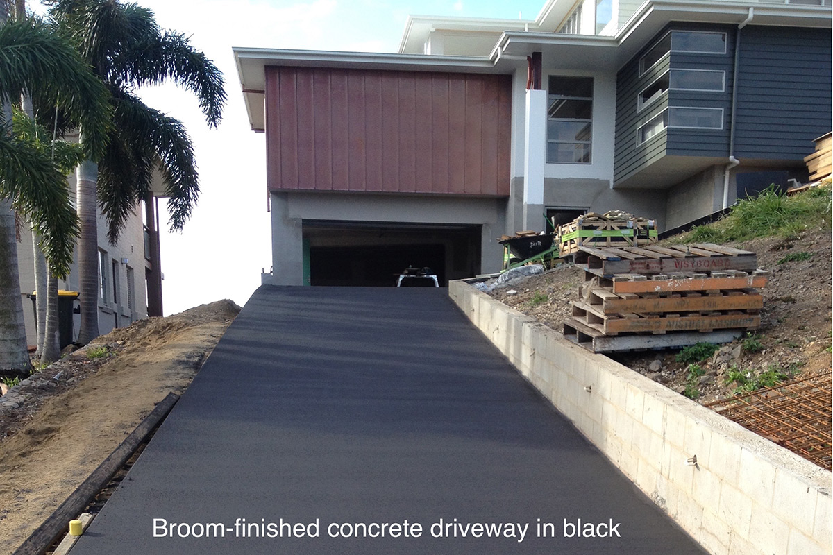 Broom-finished concrete driveway in black, by Shane Palmer Concreting